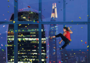 A woman climbing a wall at 22 Bishopsgate