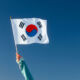 Korea’s GEPS returns to Asia-Pacific real estate after a decade Hand waving the Korean flag.