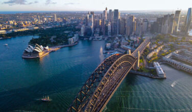 Aerial drone view of Sydney City and Sydney Harbour showing Sydney Harbour Bridge, NSW Australia in the late afternoon
