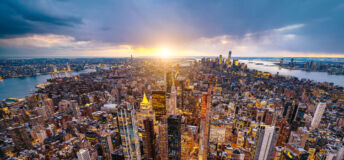 Aerial photo of New York City at sunset.
