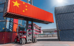 DNE Group on how times are changing for Chinese logistics Image of a product container with the China flag on it in a shipping cargo port.