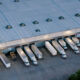 Aerial shot of large semi-trucks parked in a warehouse in Houston, Texas in the evening.