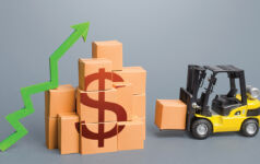 MARK Capital on future-proofing last-mile logistics Forklift near a stack of dollar boxes with a green up arrow. Sales growth concept. Production and freight of goods. Increase in imports and exports, economic recovery. World trade traffic. High income. Industrial. Logistics. T5