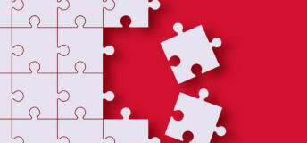 Two pieces of a jigsaw are removed from the rest of the jigsaw