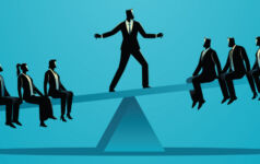 Image of a business person standing in the middle of a seesaw, balancing between a split 6-person group.