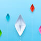 A picture of paper boats racing eachother on water