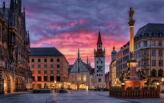 The beautiful old town of Munich, Germany, with Town Hall at the Marienplatz Square during a fiery sunrise