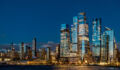 Wide view of Hudson Yards skyline and Vessel at night. Panoramic night shot of Manhattan west side with illuminated Vessel and Hudson Yards modern skyscrapers.