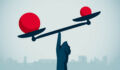 US Bank’s family office division bets on niche strategies over mega-funds Image of a hand balancing red balls on a scale.